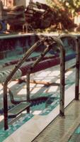 An abandoned swimming pool devoid of any signs of life video