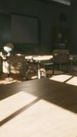 View to classroom with tables and small blackboard and grungy walls video