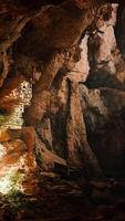 A mysterious cave illuminated by a beam of light video