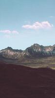 A majestic mountain range with scattered clouds in the sky video