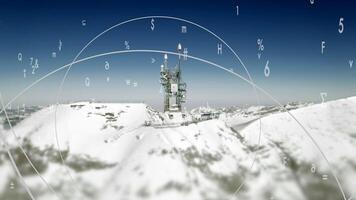 Aerial view of radio antenna tower standing on high snow mountain video