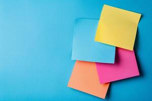 Colorful Paper Stickers with Space for Text and Sticky Notes on Blue Background photo