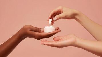 Mock Up of Two Hands Holding and Applying Cream from a Jar on Pink Background - Beauty and Cosmetics Product photo
