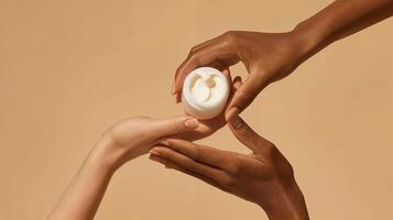 Mock-Up of Two Hands Holding and Sharing Cream from a Jar on Beige Background - Beauty and Cosmetics Product photo