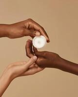 Mock Up of Hands Holding an Open Cream Jar on Beige Background - Beauty and Cosmetics Product photo