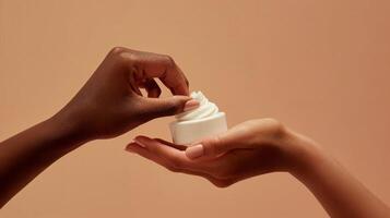 MockUp of Two Hands Applying Cream from a Jar on Beige Background, Beauty and Cosmetics Product photo