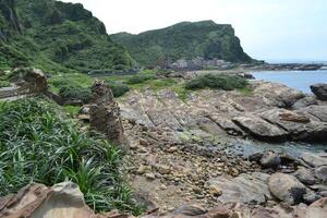 Scenic view of cliffs and beaches in the Nanya rocks area photo