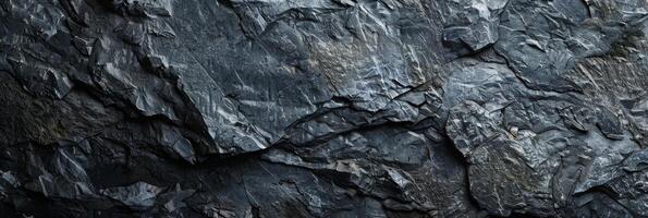 A closeup view of a dark slate stone texture that is perfect for backgrounds, textures, and natural material themes photo