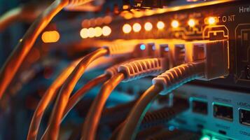 Detailed shot of network cables and server equipment in a technology data center with vivid lighting. photo