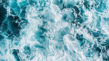 Captured from a stunning aerial view, the immense force and beauty of ocean waves in motion showcase the seas dynamic energy and natural magnificence, revealing a truly breathtaking sight photo