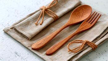 Wooden Spoon and Fork on Linen Napkin photo