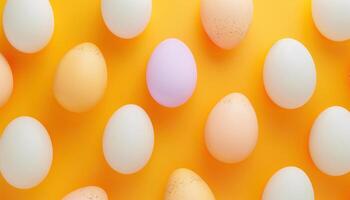 Colorful Pastel Eggs on Vibrant Yellow Background photo