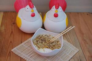 noodles soup with fried eggs. Spicy sauce photo