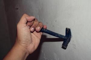 pulling nails out of the wall photo