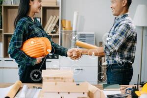 Engineer desk with object paper and tablet with blurry engineer teamwork hardworking to consults about their building photo