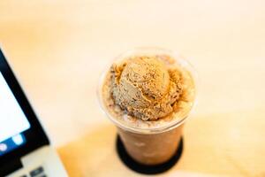 Ice cream coffee float on top of mocha frappe coffee photo