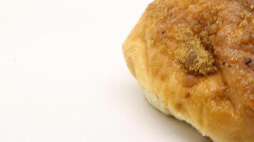 Delicious bread with shredded topping isolated photo