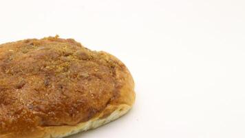 Delicious bread with shredded topping isolated photo