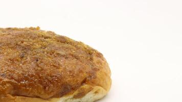 Delicious bread with shredded topping isolated photo