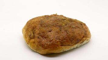Delicious bread with shredded topping isolated photo