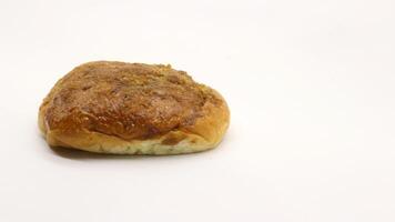 Delicious bread with shredded topping isolated photo