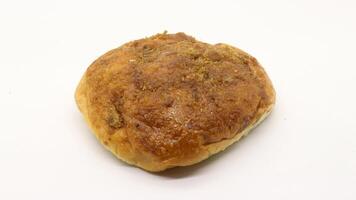 Delicious bread with shredded topping isolated photo