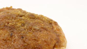 Delicious bread with shredded topping isolated photo