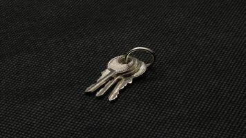 The key is silver with a black background. photo