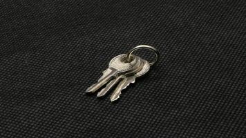 The key is silver with a black background. photo