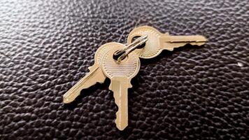 The key is silver with a black background. photo