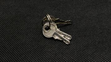The key is silver with a black background. photo