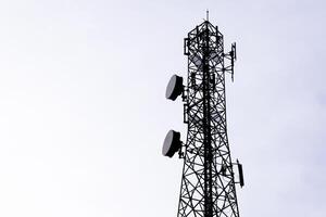 Tall Communication Tower Against Clear Sky for Telecommunication and Broadcasting photo