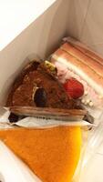 cake slices in a white box. food for comfort. delicious dessert. photo