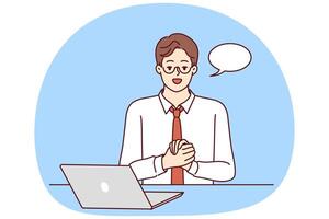 Businessman is sitting at table with laptop and looking at camera recording business training vector