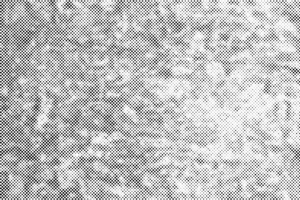 Black dots grunge halftone texture effect on white background.