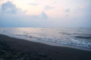 Atmosphere on the beach cities of Tegal which is often called Pantai Alam Indah photo