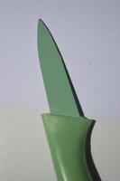 sharp kitchen knives used for cooking, knife set of various shapes and uses put together on a white background photo