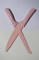 sharp kitchen knives used for cooking, knife set of various shapes and uses put together on a white background photo