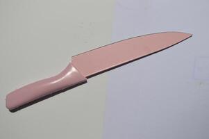 sharp kitchen knives used for cooking, knife set of various shapes and uses put together on a white background photo