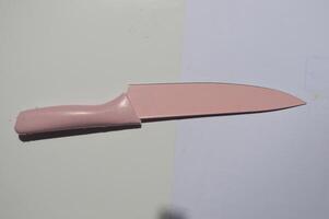 sharp kitchen knives used for cooking, knife set of various shapes and uses put together on a white background photo