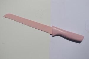 sharp kitchen knives used for cooking, knife set of various shapes and uses put together on a white background photo