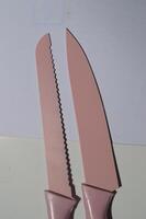 sharp kitchen knives used for cooking, knife set of various shapes and uses put together on a white background photo