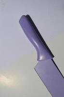sharp kitchen knives used for cooking, knife set of various shapes and uses put together on a white background photo