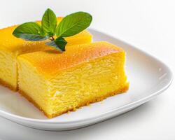 a plate with two pieces of cake on it photo