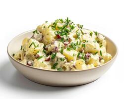 a bowl of potato salad with herbs and cheese photo