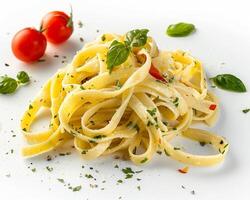 pasta with tomatoes and herbs on a white plate photo