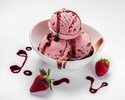 a bowl of ice cream with strawberries and syrup photo