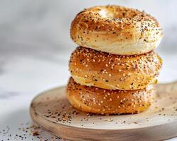 a stack of bagels on a wooden board photo