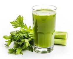 a glass of green juice with celery and celery photo