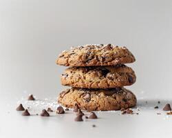 a stack of cookies with chocolate chips on top photo